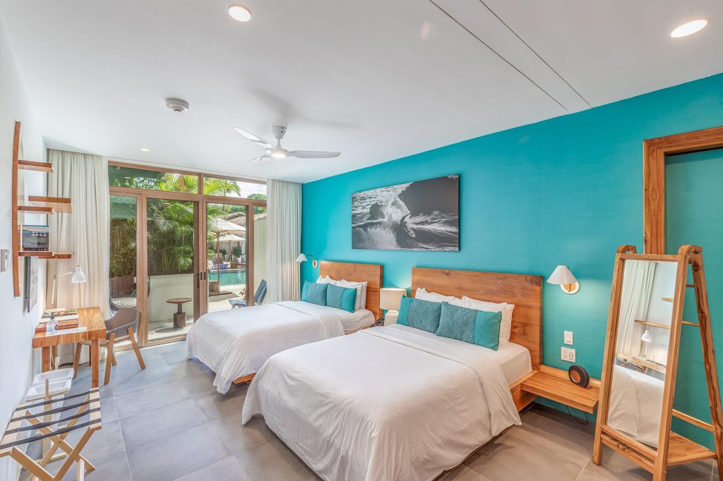 Premium Two Queen Beds Gilded Iguana