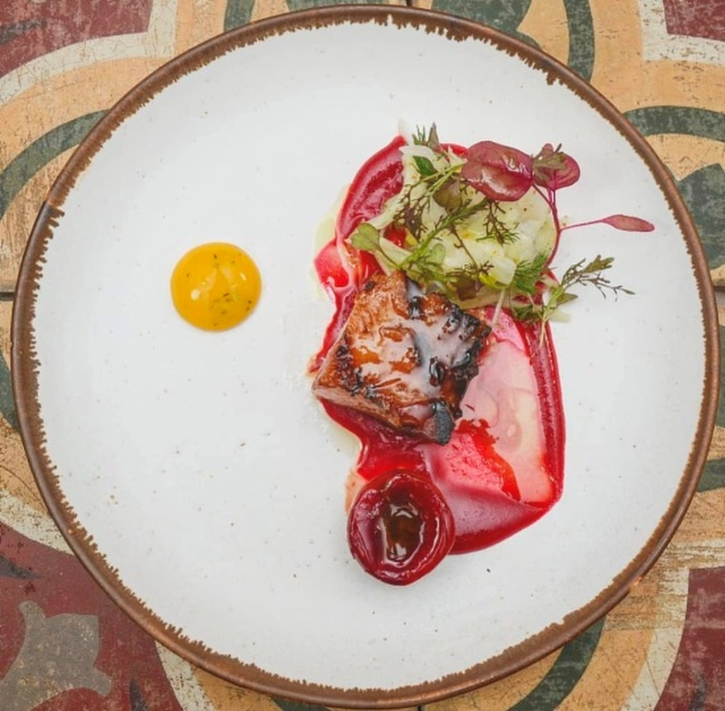 Homemade smoked bacon, blood plums, and fennel at Restaurant Silvestre
